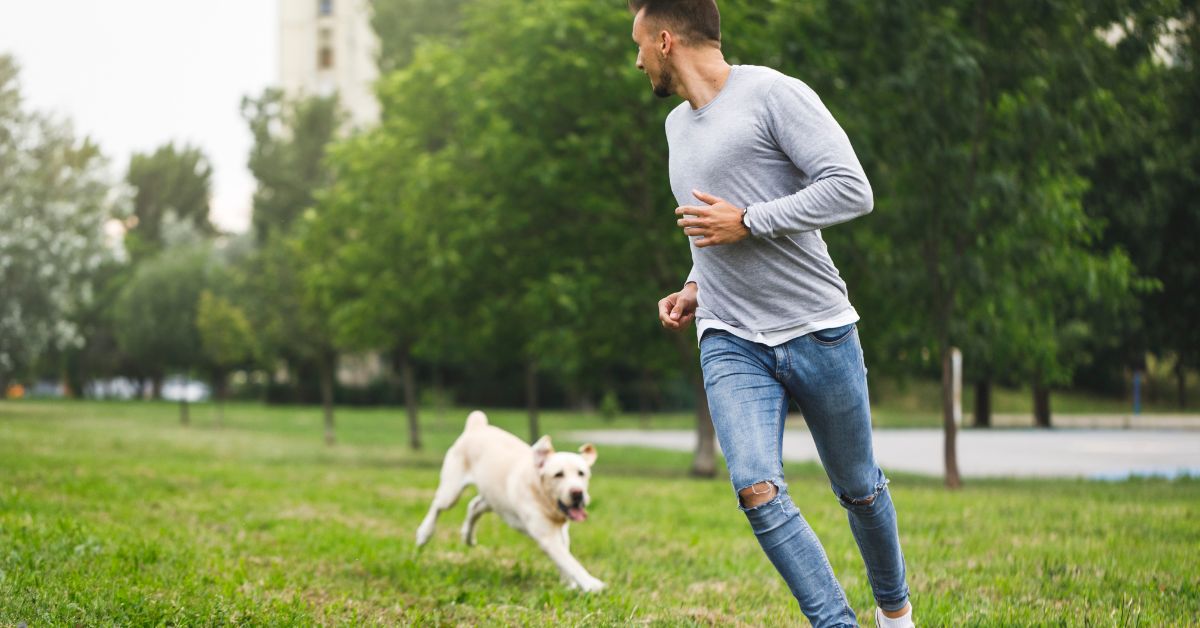 Dog running with his owner